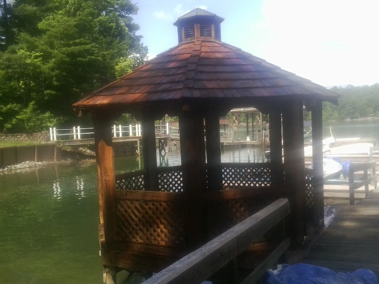 Cedar shake gazebo roof rebuilt on a lake dock in Monterey Park